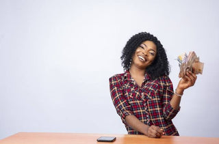 Woman Holding Money - How to Build Wealth in Your 30s